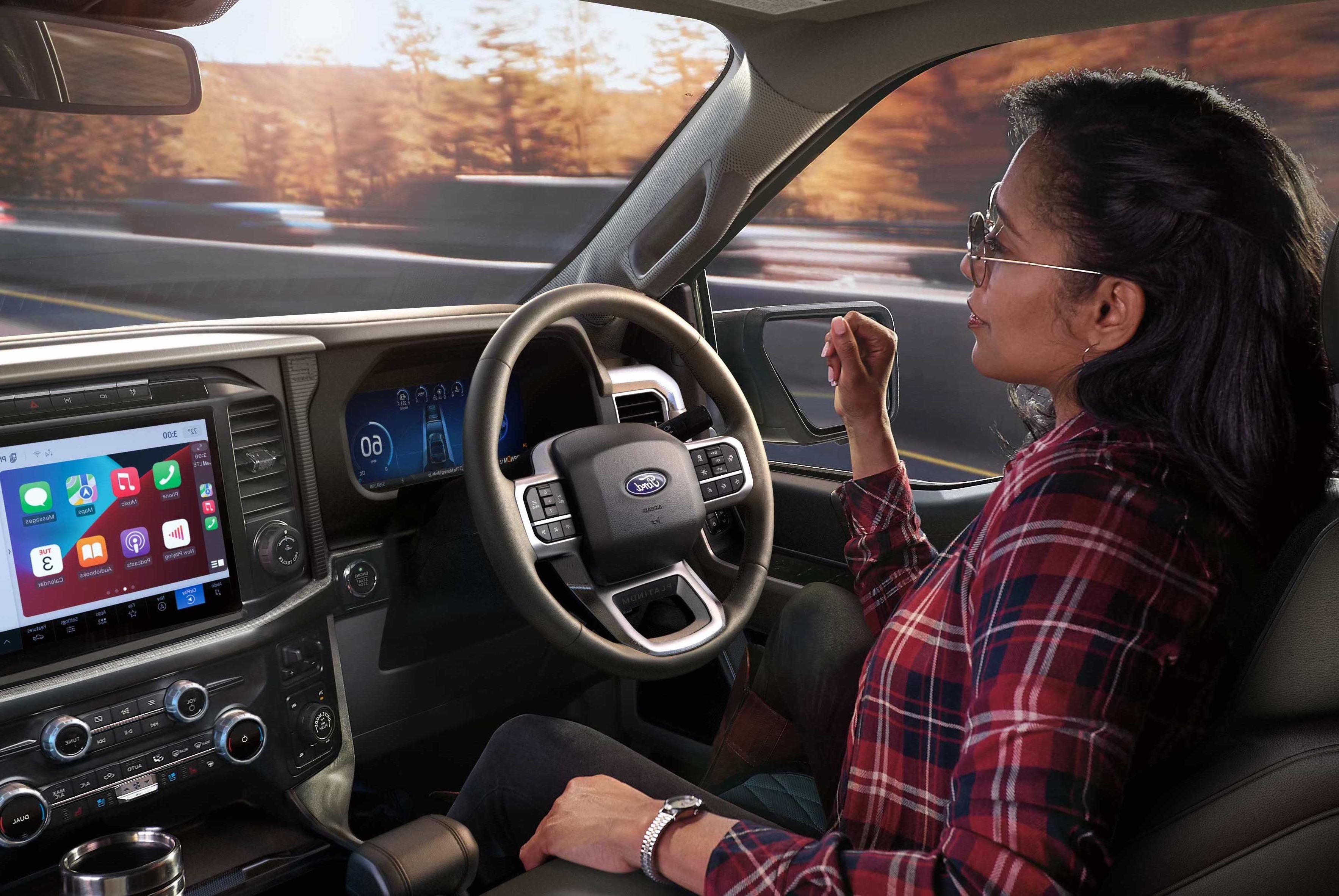 Driver's perspective of the Head-Up Display projected on to the windshield viewing the Ford BlueCruise screen